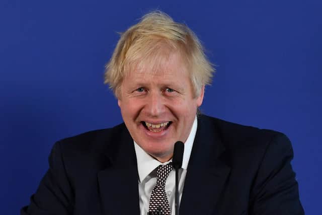 Boris Johnson laughing in 2019, but has the Sue Gray report wiped the smile off his face? (Picture: Ben Stansall/AFP via Getty Images)