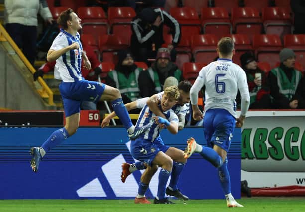 Kilmarnock's David Watson (centre) celebrates after scoring an injury-time winner against Aberdeen at Pittodrie. (Photo by Ross MacDonald / SNS Group)