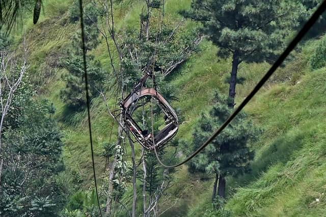 This photograph shows a view of the chairlift cable in the Pashto village of mountainous Khyber Pakhtunkhwa province, a day after it broke sending passengers plunging into a ravine. Military helicopters and ziplining commandos rescued eight people, including six schoolboys, who were trapped for hours.