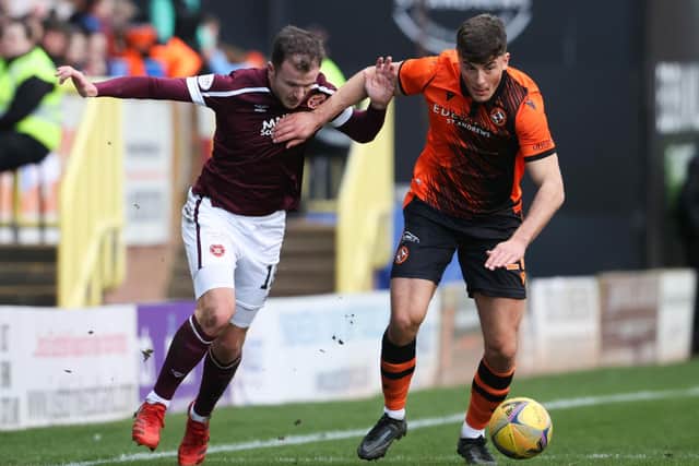 Hearts' utility man Andy Halliday and Dundee United's Ross Graham jostle for possession.  (Photo by Alan Harvey / SNS Group)