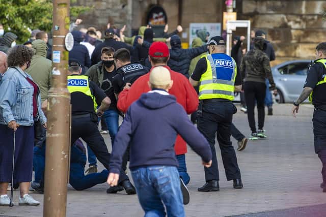 Police intervene as supporters clash during a cinch Premiership match between Hearts and Celtic at Tynecastle Park , on July 31, 2021, in Edinburgh, Scotland. (Photo by Alan Harvey / SNS Group)
