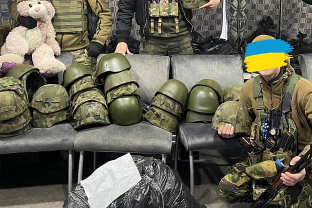 Ukrainian soldiers on the front line with equipment sourced by Oleksii Rudenko and his friends.
