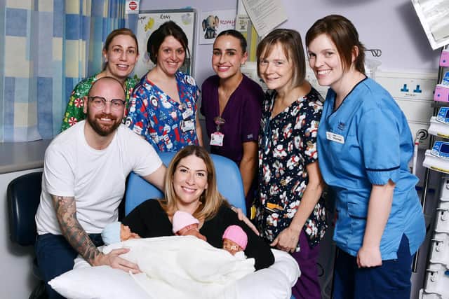 Ricki and Fiona Zebik with their triplets and some of the team who helped to deliver and look after them, left to right: Dana Hutt, senior neonatal staff nurse; Ali Leighton, senior neonatal staff nurse; Dayna Lipski, midwife; Cathy Brown, advanced neonatal nurse practitioner; and Kayleigh Cunningham, senior neonatal staff nurse. Pic: Michael Gillen