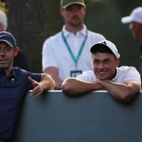 Rory McIlroy and Ludvig Aberg wait on the 17th tee late on the second day of the BMW PGA Championship at Wentworth Club. Picture: Richard Heathcote/Getty Images.