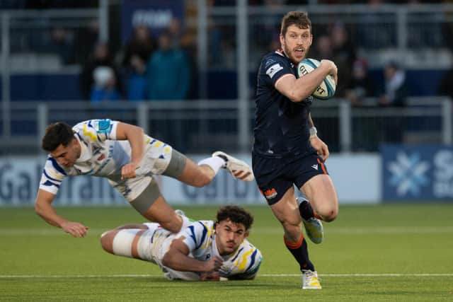 Edinburgh's Mark Bennett leaves a couple of Zebre players in his wake. (Photo by Ross Parker / SNS Group)