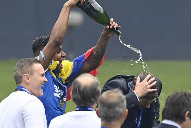 Rangers' Alfredo Morelos covers manager Steven Gerrard in champagne during the Scottish Premiership match between Rangers and Aberdeen at Ibrox Stadium, on May 15, 2021, in Glasgow, Scotland. (Photo by Rob Casey / SNS Group)