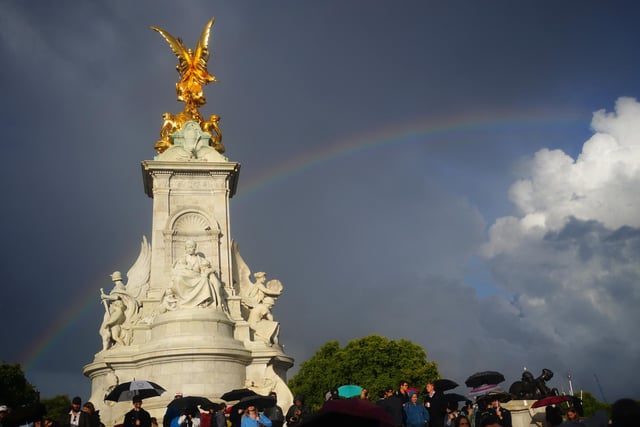 A rainbow over Queen Victoria Memorial, as members of the public gather outside Buckingham Palace in central London. Queen Elizabeth II is under medical supervision with the royal family rushing to be by her side amid serious health fears.