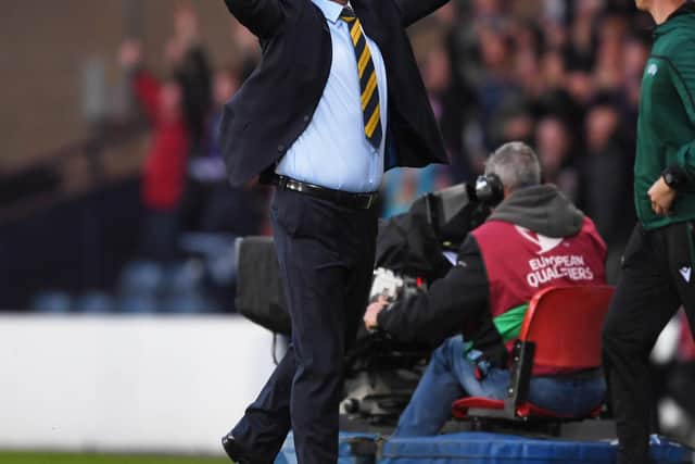 Steve Clarke celebrates the victory in his first match in charge of Scotland.