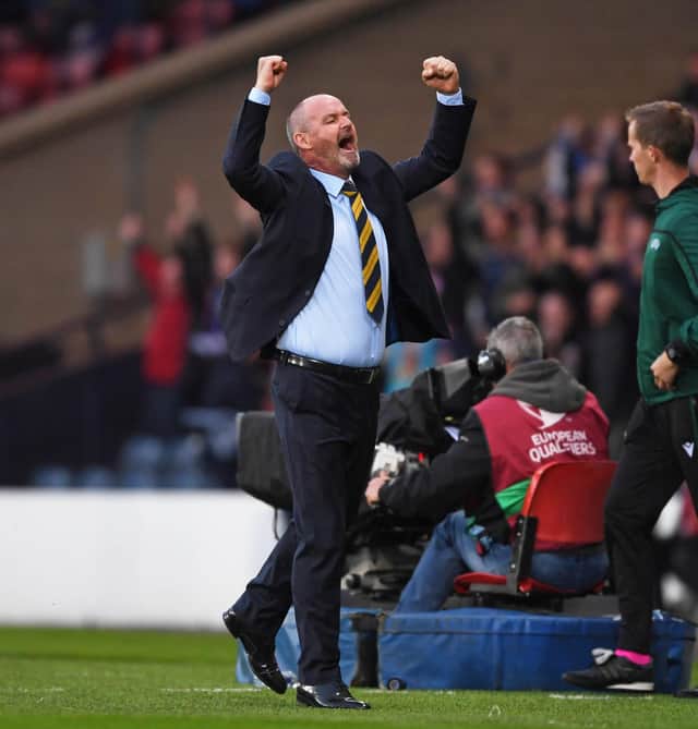 Steve Clarke celebrates the victory in his first match in charge of Scotland.