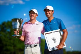 Rory McIlroy and his caddie Harry Diamond celebrate with the trophy after winning the Wells Fargo Championship at Quail Hollow Club in Clifton, North Carolina. Picture: Jared C. Tilton/Getty Images.