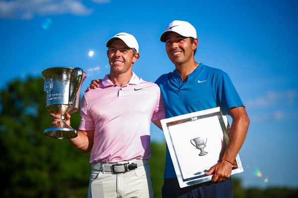 Rory McIlroy and his caddie Harry Diamond celebrate with the trophy after winning the Wells Fargo Championship at Quail Hollow Club in Clifton, North Carolina. Picture: Jared C. Tilton/Getty Images.