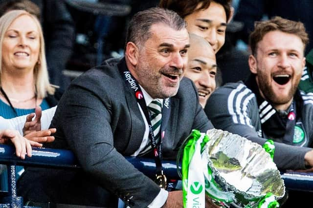 Celtic manager Ange Postecoglou lifts the Viaplay Cup trophy after a 2-1 win over Rangers.