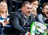 Celtic manager Ange Postecoglou lifts the Viaplay Cup trophy after a 2-1 win over Rangers.