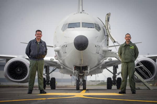 Group Captain Chris Layden station commander (left) and Wing Commander James Hanson, in front of the first of the Poseidon MRA1 plane, intended for submarine-hunting and the tracking of maritime targets, to arrive at RAF Lossiemouth, Moray
