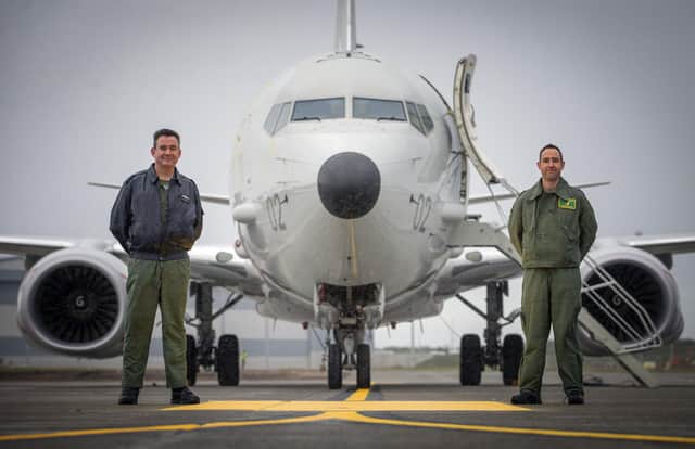 Group Captain Chris Layden station commander (left) and Wing Commander James Hanson, in front of the first of the Poseidon MRA1 plane, intended for submarine-hunting and the tracking of maritime targets, to arrive at RAF Lossiemouth, Moray