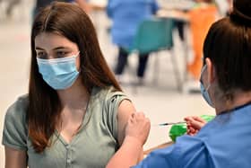 Teenager Katie Moore receives a Covid vaccination at the Barrhead Foundry vaccination centre near Glasgow. Picture: PA