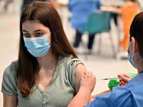 Teenager Katie Moore receives a Covid vaccination at the Barrhead Foundry vaccination centre near Glasgow. Picture: PA