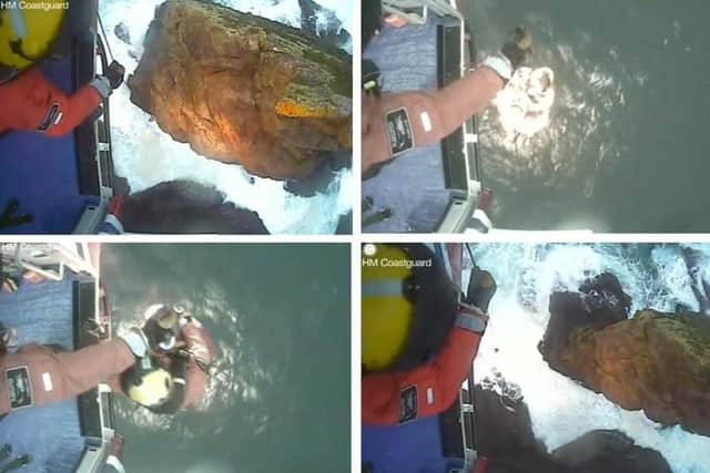 Dramatic footage from HM Coastguard shows the terrifying moment that two men were rescued from a 60 metre sea stack in the Scottish Highlands.