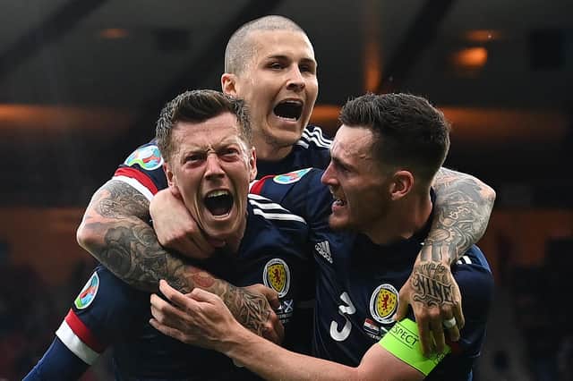 Callum McGregor celebrates his Scotland strike with Andy Robertson and Lyndon Dykes, but Croatia claimed a 3-1 win to progress to the Euro 2020 last 16. (Photo by PAUL ELLIS/POOL/AFP via Getty Images)