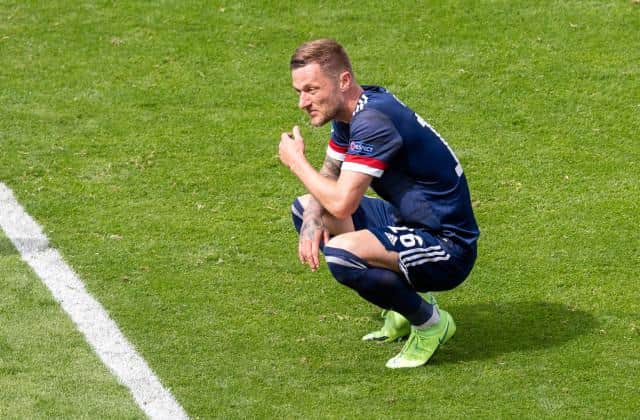 Liam Cooper is left dejected at the end of Scotland's 2-0 defeat against Czech Republic at Hampden in their opening Euro 2020 Group D match. (Photo by Ross Parker / SNS Group)
