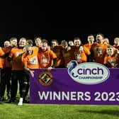 Dundee United players and staff celebrate winning the cinch Championship title following the goalless draw at Airdrie. (Photo by Craig Foy / SNS Group)