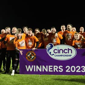 Dundee United players and staff celebrate winning the cinch Championship title following the goalless draw at Airdrie. (Photo by Craig Foy / SNS Group)