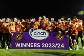 Dundee United players and staff celebrate winning the cinch Championship title following the goalless draw at Airdrie. (Photo by Craig Foy / SNS Group)