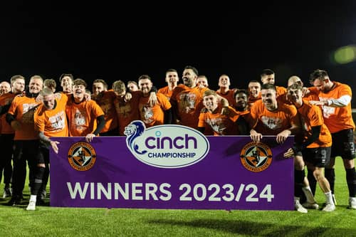 Dundee United players and staff celebrate winning the cinch Championship title following the goalless draw at Airdrie. (Photo by Craig Foy / SNS Group)