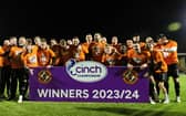 Dundee United players and staff celebrate winning the cinch Championship title following the goalless draw at Airdrie. (Photo by Craig Foy / SNS Group)