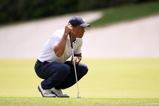 Tiger Woods lines up a putt on the 13th green during the first round of the 2023 Masters. Picture: Ross Kinnaird/Getty Images.