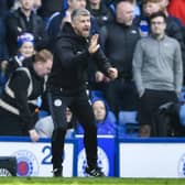 St Mirren manager Stephen Robinson encourages his players during the match at Ibrox.