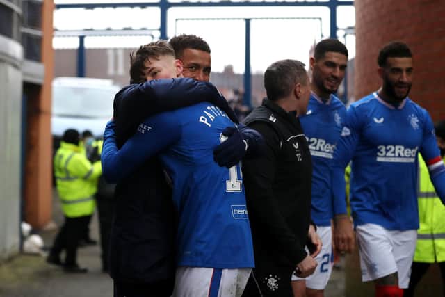 Nathan Patterson, pictured being hugged by James Tavernier after Rangers' 3-0 win over St Mirren at Ibrox on March 6, is waiting to learn his punishment from the Scottish FA for a coronavirus protocol breach. (Photo by Ian MacNicol/Getty Images).