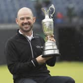 American Brian Harman shows off the Claret Jug after his stunning six-shot success in the 151st Open. Picture: Tom Russo/The Scotsman.