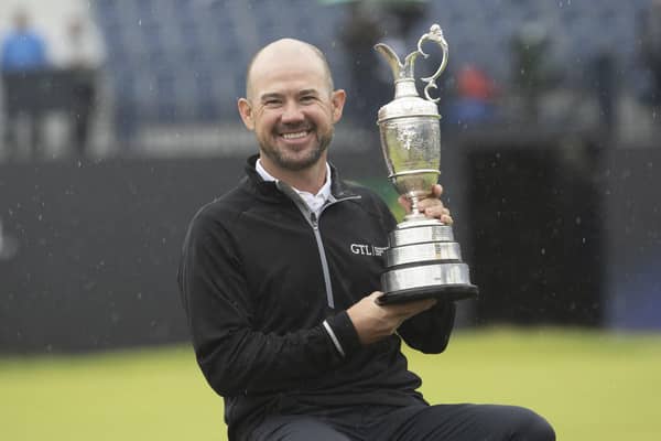American Brian Harman shows off the Claret Jug after his stunning six-shot success in the 151st Open. Picture: Tom Russo/The Scotsman.