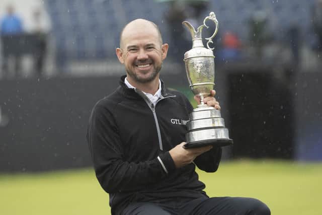 American Brian Harman shows off the Claret Jug after his stunning six-shot success in the 151st Open. Picture: Tom Russo/The Scotsman.