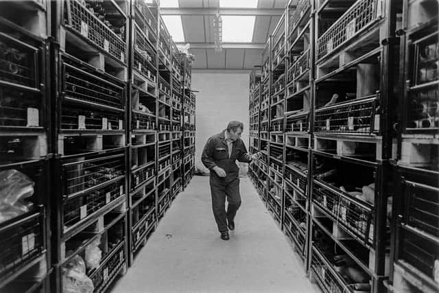Donald (Noe) Smith at the yarn store, in Kenneth Macleod, Shawbost Ltd, from ‘Harris Tweed 1992’ by documentary photographer Jeremy Sutton-Hibbert.