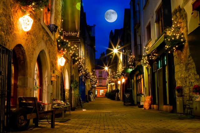The full moon rises in Galway. Photo: rihardzz.