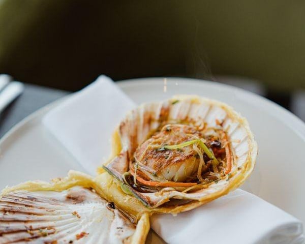 Baked Orkney Scallop, a long-time customer favourite enhanced with an incredible Asian dressing