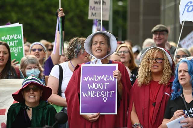 Women, including some dressed as characters from Margaret Atwood's The Handmaid's Tale, protest outside a court where Marion Millar was facing charges of threatening or abusive behaviour aggravated by prejudice relating to sexual orientation and transgender identity until the case was dropped (Picture: John Devlin)