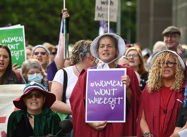 Women, including some dressed as characters from Margaret Atwood's The Handmaid's Tale, protest outside a court where Marion Millar was facing charges of threatening or abusive behaviour aggravated by prejudice relating to sexual orientation and transgender identity until the case was dropped (Picture: John Devlin)