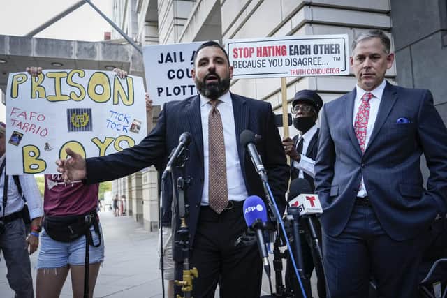Nayib Hassan and Sabino Jauregui, attorneys for Enrique Tarrio, speak to reporters as they depart federal court after a sentencing hearing for Tarrio  in Washington, DC. Enrique Tarrio, former leader of the Proud Boys, was sentenced to 22 years in prison for his role in the January 6 attack on the U.S. Capitol.