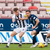 Raith's Lewis Vaughan (centre) is challenged by Euan Murray of Dunfermline.