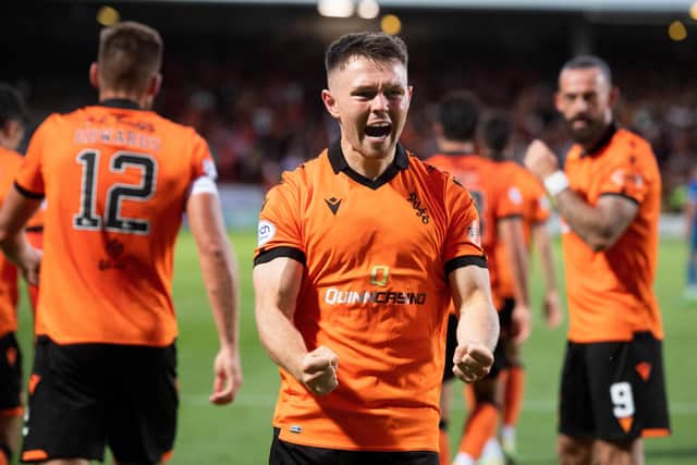 Middleton celebrates his goal in front of a raucous Tannadice.