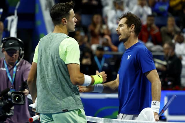Jakub Mensik prepares to shake hands with Andy Murray after his victory at the Qatar Open. (Photo by KARIM JAAFAR/AFP via Getty Images)