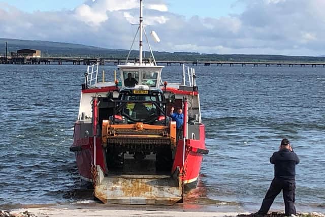 A tractor being carried on the ferry. Picture: Fraser Mackenzie