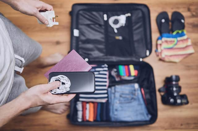 Try packing all wires together in zipped sections of your case to avoid tangles when you unpack. Pic: PA Photo/Alamy.