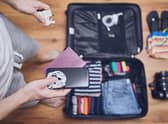 Try packing all wires together in zipped sections of your case to avoid tangles when you unpack. Pic: PA Photo/Alamy.