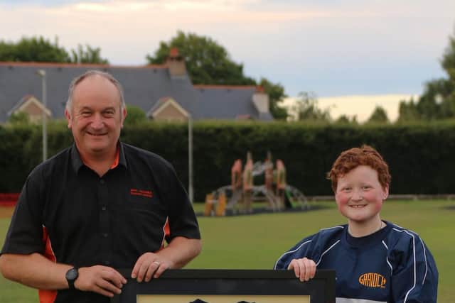 Bon Accord Training’s Operations Director, Iain Sanderson, received a framed training top from Katie Henderson of Garioch Rugby Girls Team, in recognition of their ongoing sponsorship.