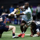 Edinburgh's  centre George Taylor (L) fights for the ball with Racing92's French flanker Jordan Joseph (C) during the match  at the U Arena in Nanterre, near Paris on April 4, 2021. (Photo by FRANCK FIFE/AFP via Getty Images)