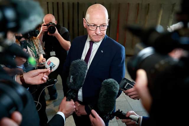 First Minister John Swinney speaks to media following FMQs at Scottish Parliament Building yesterday (Picture: Jeff J Mitchell/Getty Images)